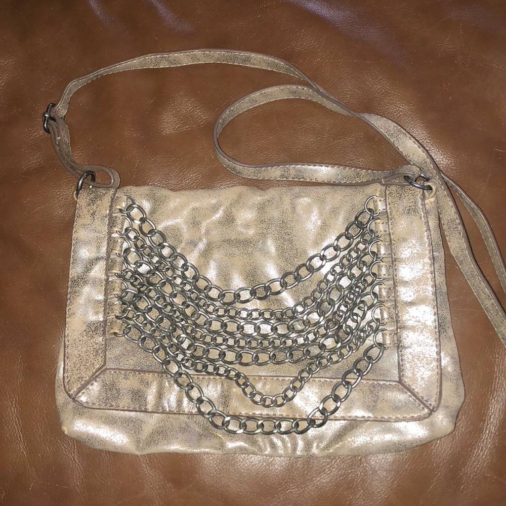 Brown metallic satchel purse with chains.
